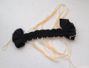 Pattern threads pulled creating resist for bleaching process.