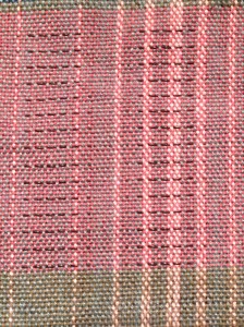 Sample on loom.  Black threads are pattern pull threads.